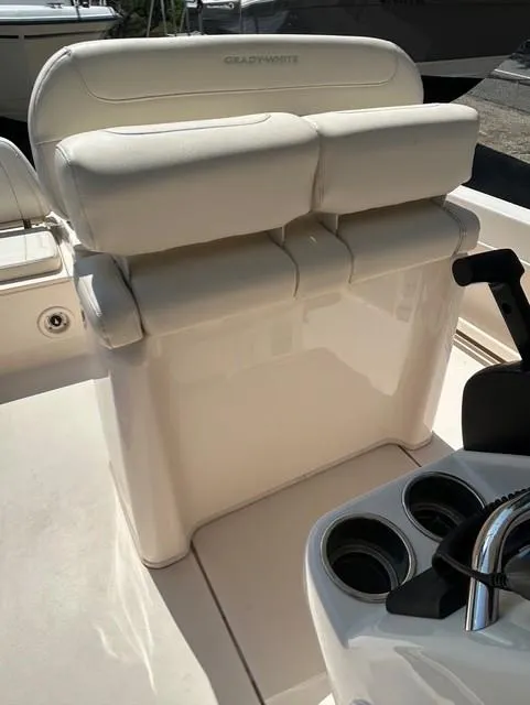 Slide: The Image of 2021 Grady-White Fisherman 216 boat interior with cushioned seating and cup holders. - 11