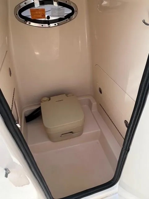Slide: The Image of Portable toilet inside 2021 Grady-White Fisherman 216 boat cabin. - 13