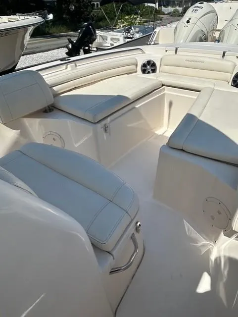 Slide: The Image of 2021 Grady-White Fisherman 216 boat interior with cushioned seating and storage compartments. - 14