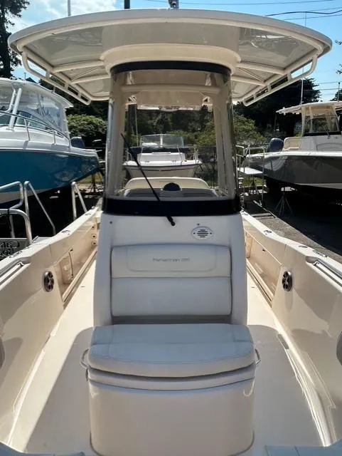 Slide: The Image of 2021 Grady-White Fisherman 216 boat with center console and seating, docked outdoors. - 16