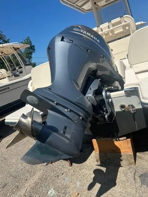 Slide: The Image of 2021 Grady-White Fisherman 216 with Yamaha outboard motor, docked on a sunny day. - 17