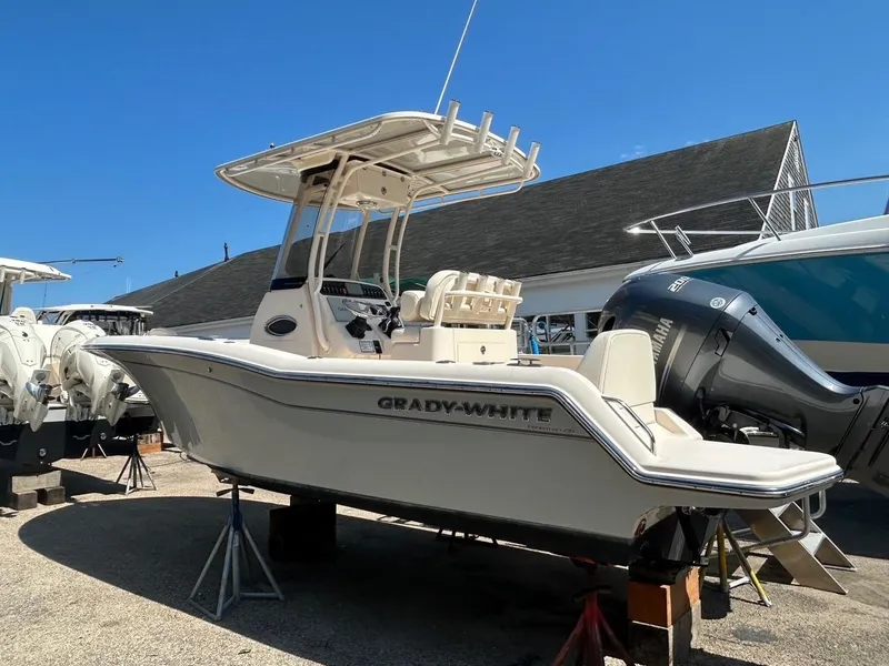 Slide: The Image of 2021 Grady-White Fisherman 216 boat on display under clear blue sky. - 3