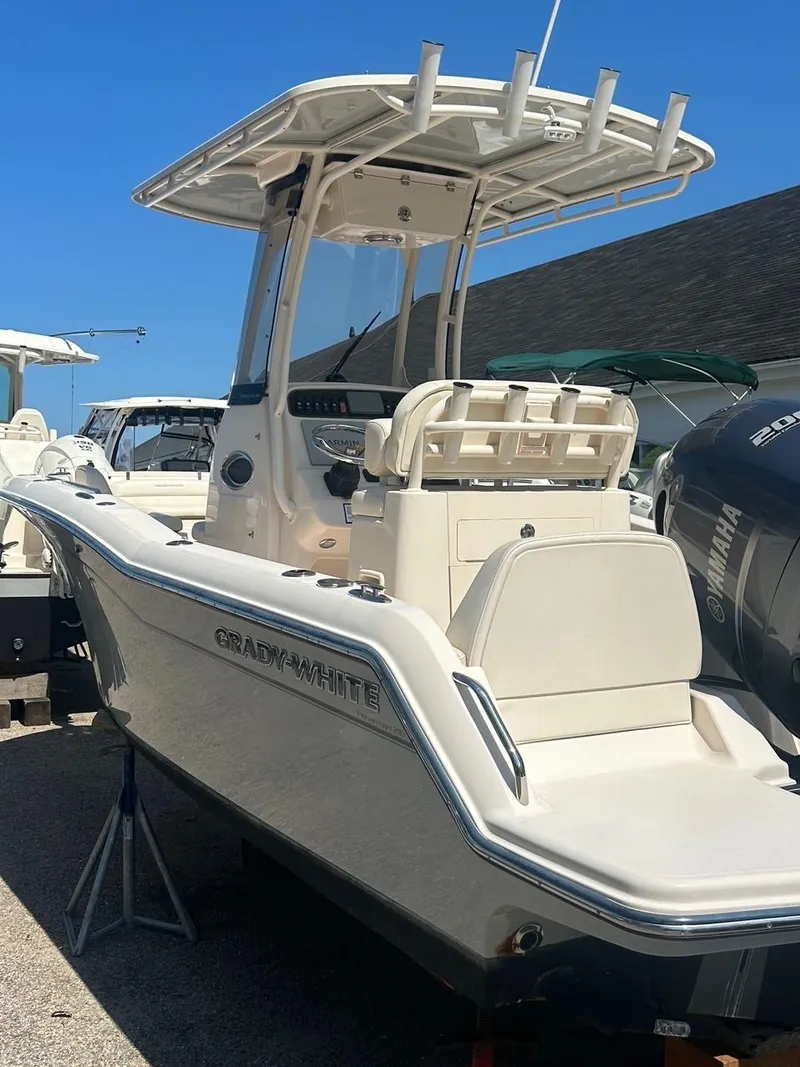 Slide: The Image of 2021 Grady-White Fisherman 216 boat with Yamaha engine, parked outdoors. - 4