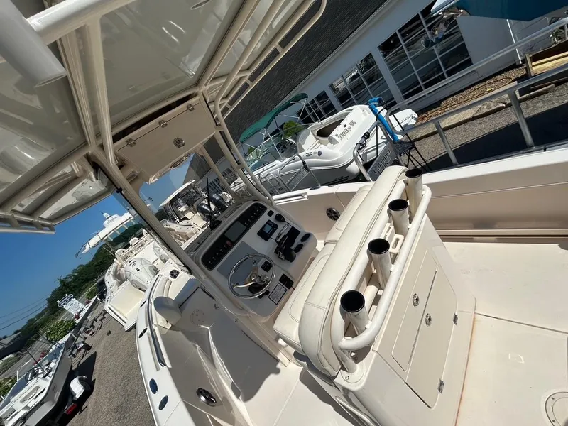 Slide: The Image of 2021 Grady-White Fisherman 216 boat interior with helm and seating area. - 7