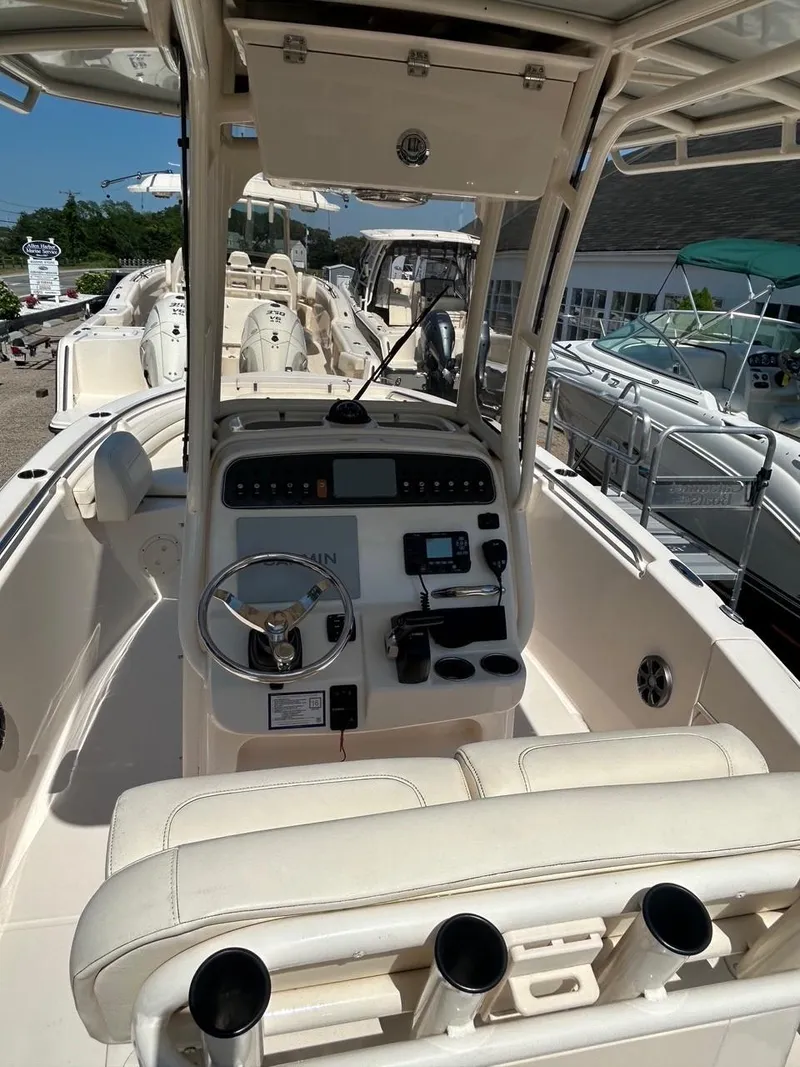 Slide: The Image of 2021 Grady-White Fisherman 216 boat interior with steering console and seating. - 8