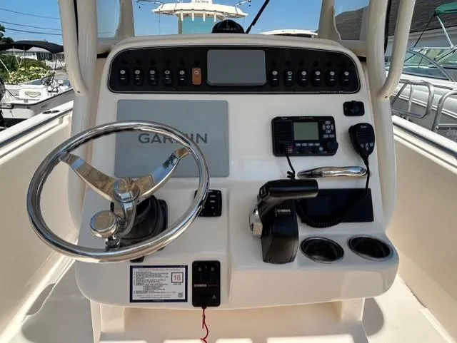 Slide: The Image of 2021 Grady-White Fisherman 216 boat console with Garmin navigation and control panel. - 9