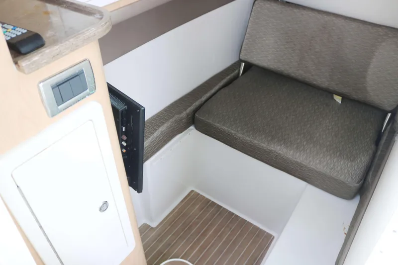 Slide: The Image of Interior of 2017 World Cat 320DC boat with seating and control panel. - 10