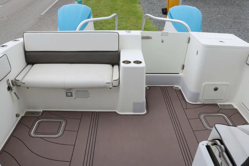 Slide: The Image of 2017 World Cat 320DC boat interior with seating and storage compartments. - 15