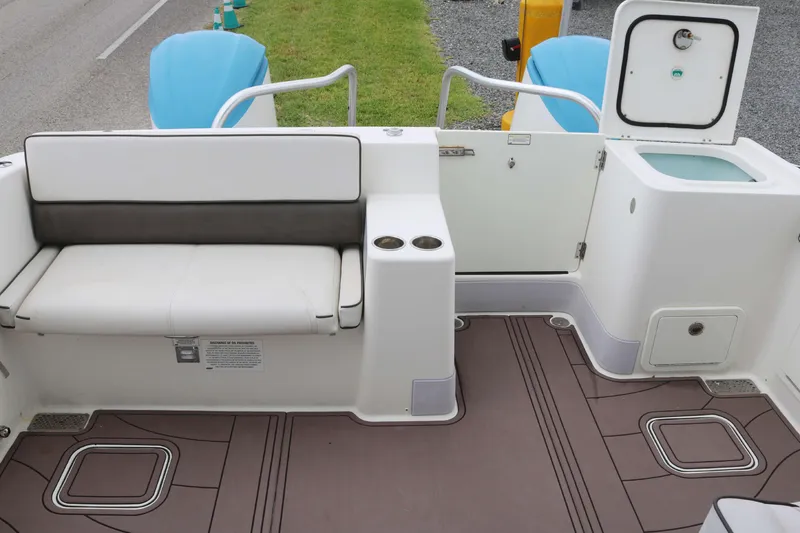 Slide: The Image of 2017 World Cat 320DC boat interior with seating and storage compartments. - 16