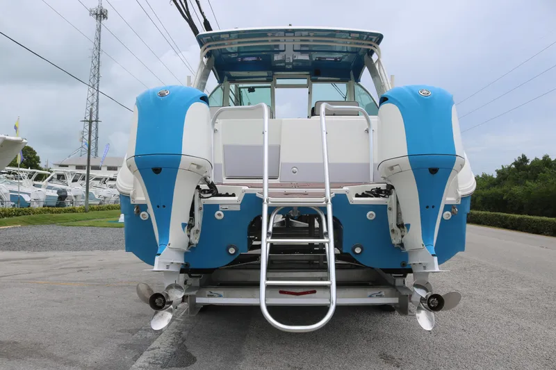 Slide: The Image of 2017 World Cat 320DC boat with dual outboard engines, rear view. - 4