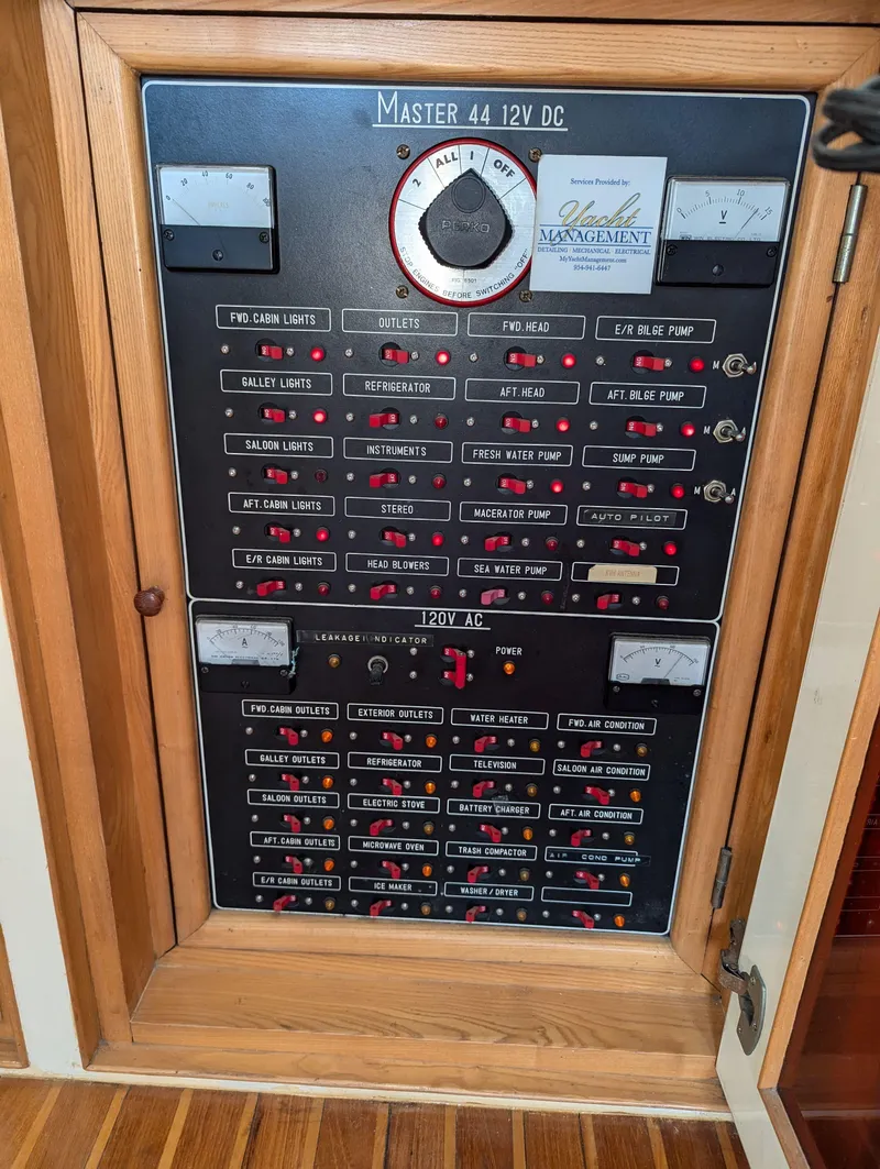 Slide: The Image of Electrical control panel of a Custom Hi-tech 44, 1988 model, with labeled switches and meters. - 11