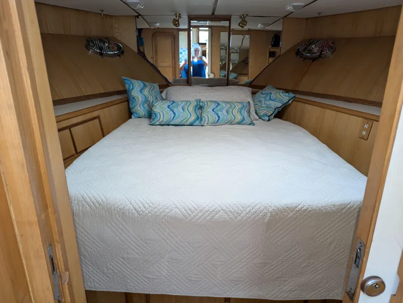 Slide: The Image of Cozy bedroom in 1988 Custom Hi-tech 44 yacht with quilted bedding and decorative pillows. - 18