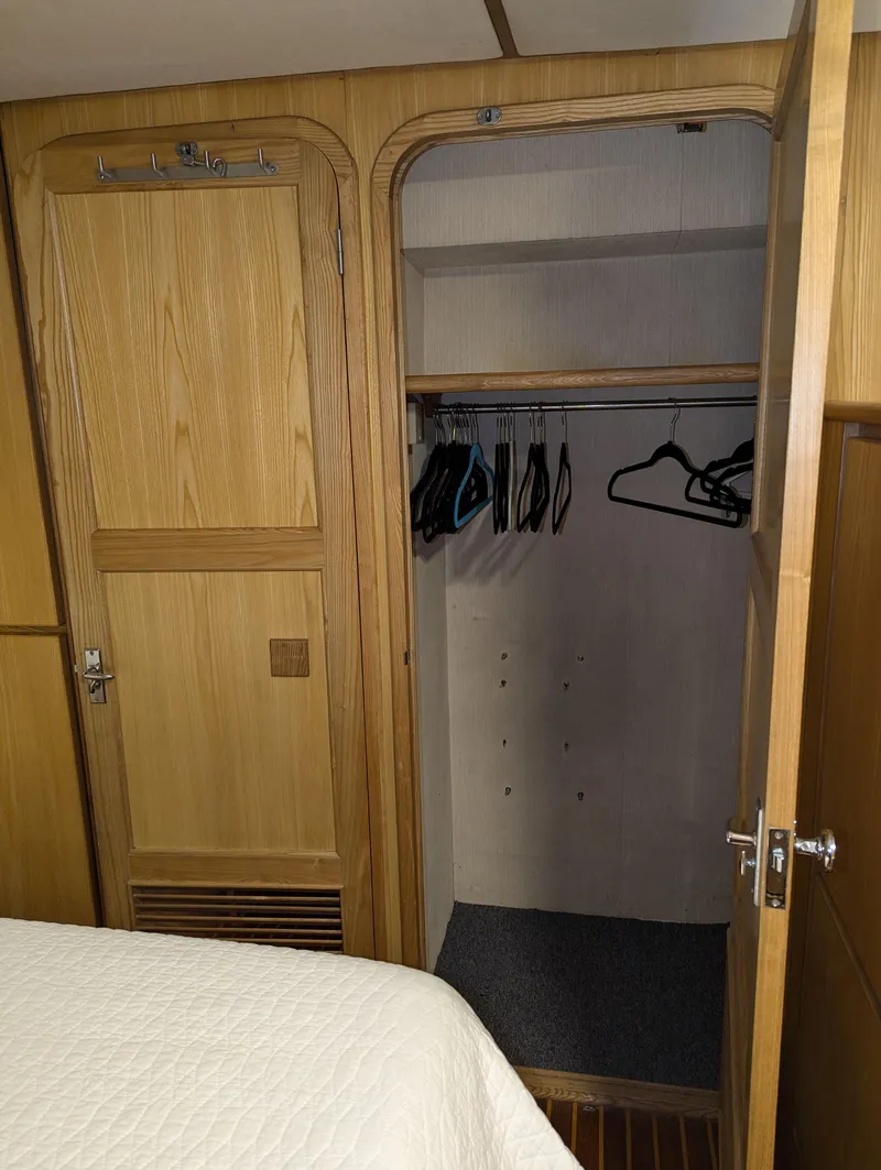 Slide: The Image of Wooden closet with hangers in a Custom Hi-tech 44, 1988 model. - 20