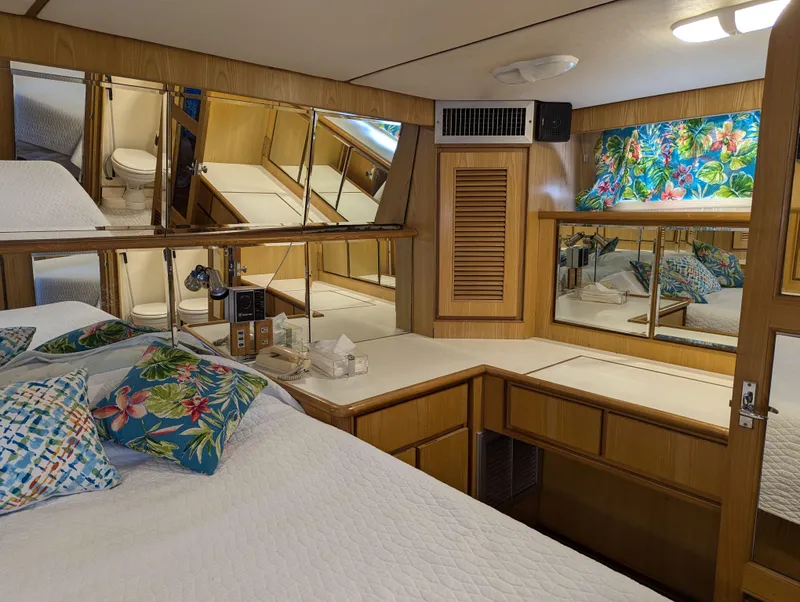 Slide: The Image of Luxurious 1988 Custom Hi-tech 44 yacht bedroom with floral decor and mirrored walls. - 23