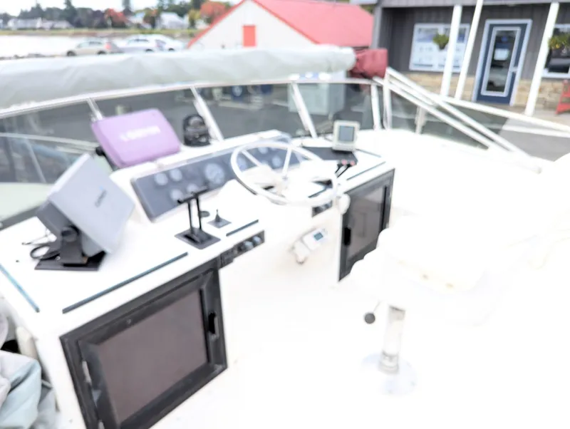 Slide: The Image of Cockpit of 1988 Custom Hi-tech 44 boat with navigation equipment and steering wheel. - 5