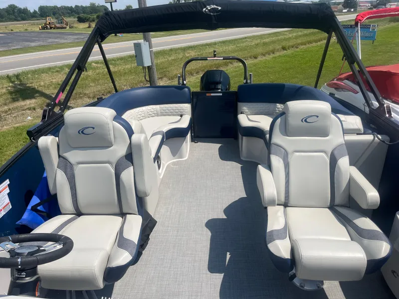 Slide: The Image of 2022 Crest Caribbean LX 250 CP3 boat interior with plush seating and modern design. - 8