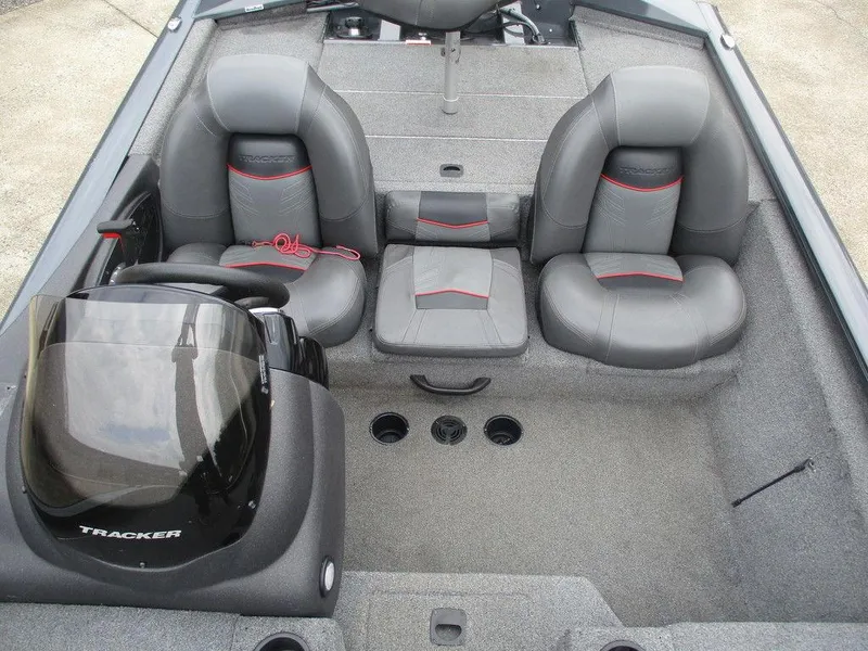 Slide: The Image of 2021 Tracker Pro Team™ 190 TX boat interior with gray seating and steering console. - 7