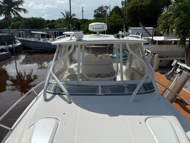 Slide: The Image of 2008 Hydra-Sports 3500VX boat docked, featuring Garmin equipment and sleek design. - 25