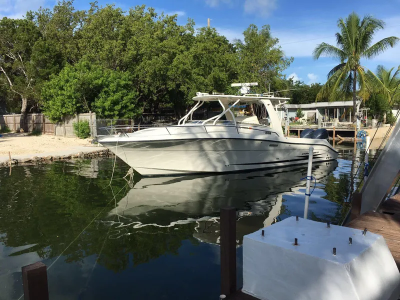 Slide: The Image of 2008 Hydra-Sports 3500VX boat docked in a scenic, tropical setting. - 30