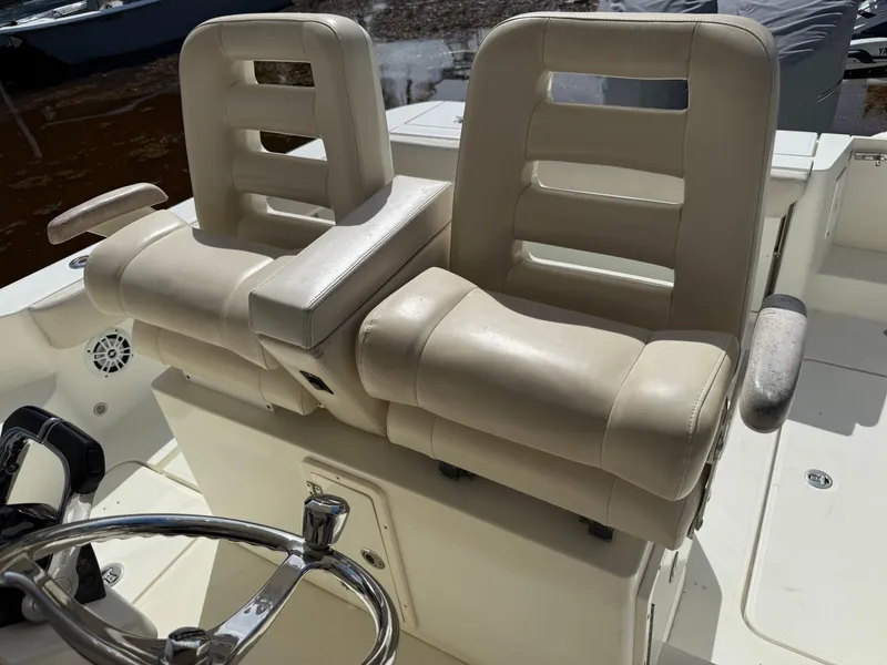 Slide: The Image of 2008 Hydra-Sports 3500VX boat with dual beige captain's chairs and steering wheel. - 34