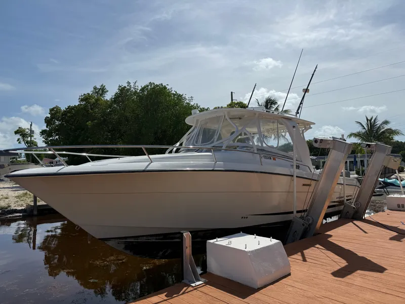 Slide: The Image of 2008 Hydra-Sports 3500VX boat docked, surrounded by trees and clear sky. - 37