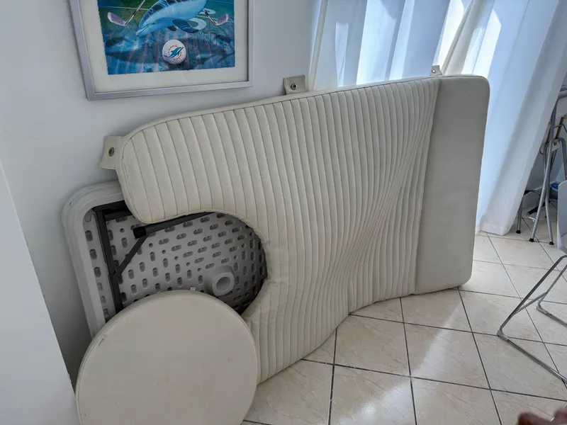 Slide: The Image of Cushioned boat seat from a 2008 Hydra-Sports 3500VX, placed indoors on tiled floor. - 39