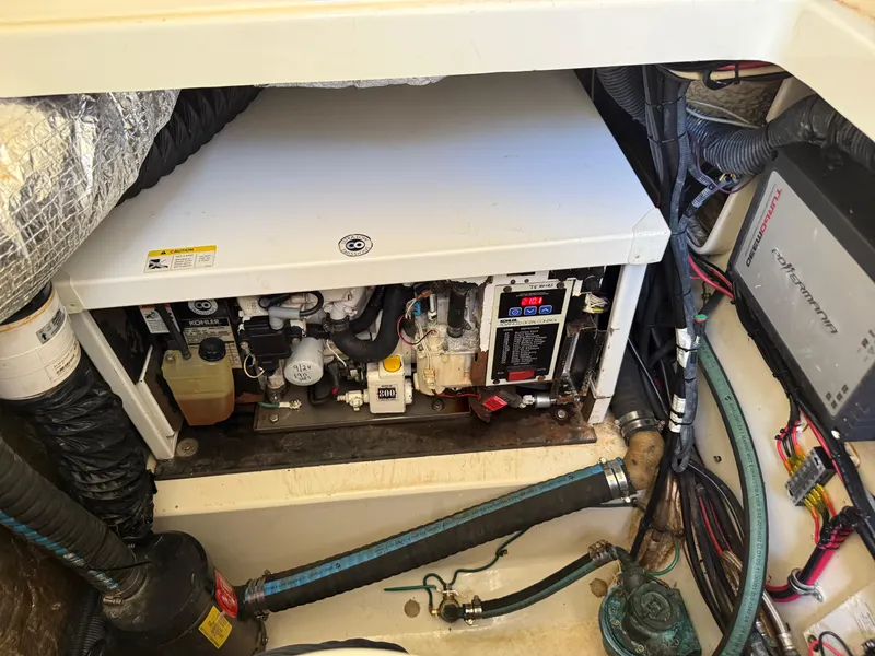 Slide: The Image of Engine compartment of a 2008 Hydra-Sports 3500VX boat, featuring a Kohler generator. - 45