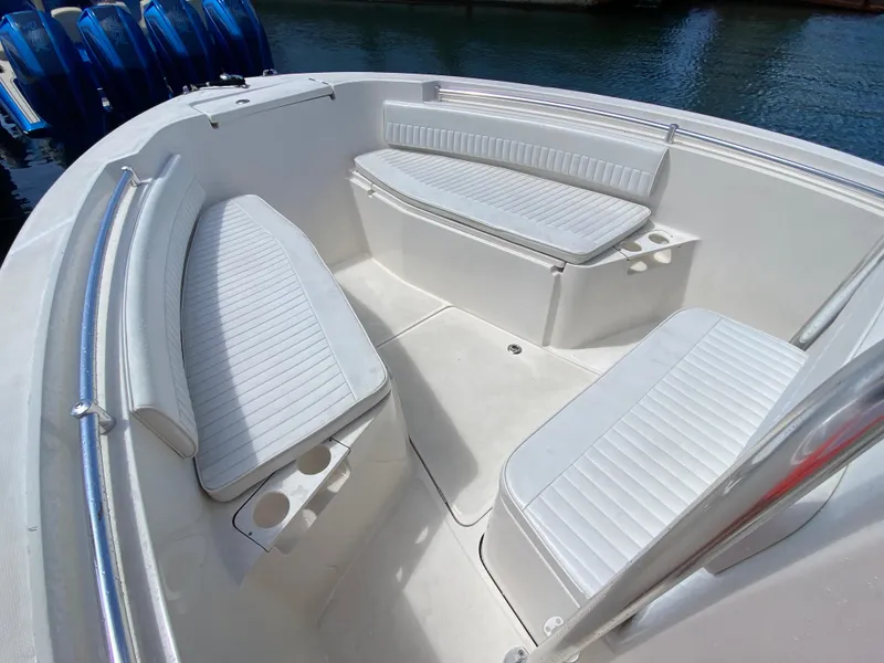 Slide: The Image of Interior of 2018 Release 208 SXC boat with white seating and cup holders. - 14