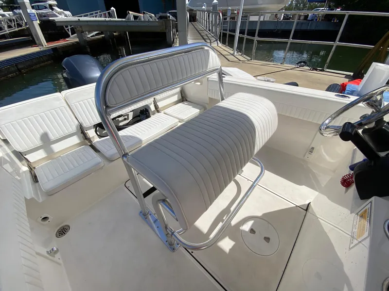 Slide: The Image of Interior of 2018 Release 208 SXC boat with white seating and steering console. - 15