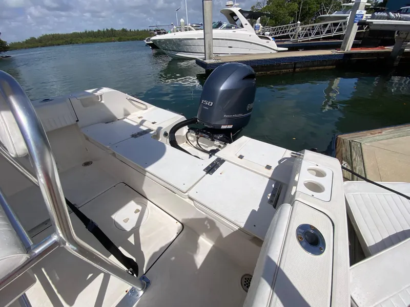 Slide: The Image of Boat docked with Yamaha outboard motor, Release 208 SXC, 2018 model, sunny day. - 18