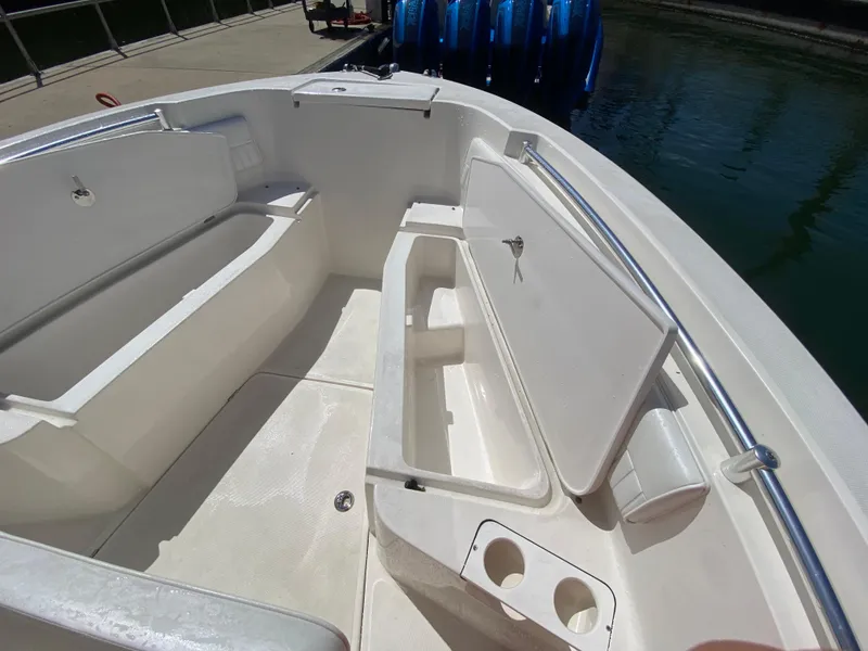 Slide: The Image of Interior of 2018 Release 208 SXC boat with open storage compartments. - 19