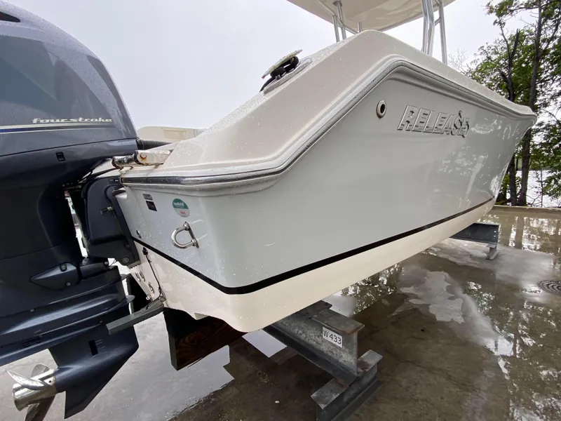 Slide: The Image of 2018 Release 208 SXC boat with four-stroke engine on a stand. - 3