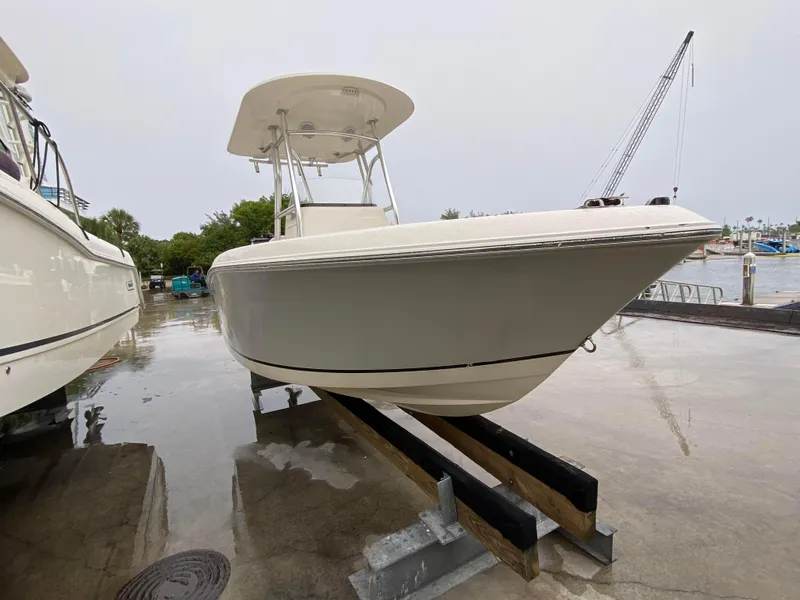 Slide: The Image of 2018 Release 208 SXC boat on trailer at marina, overcast day. - 5