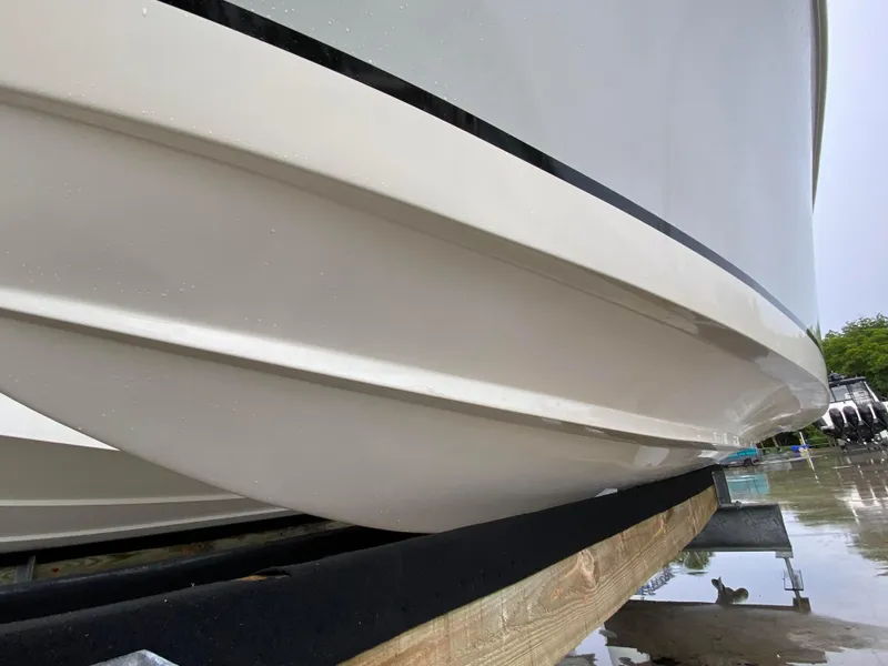 Slide: The Image of Close-up of 2018 Release 208 SXC boat hull on a trailer. - 6