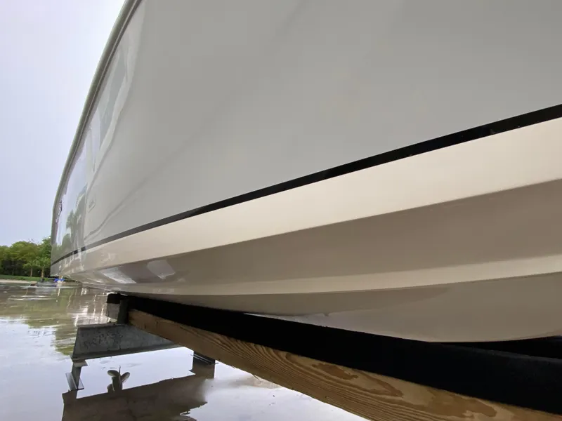Slide: The Image of 2018 Release 208 SXC boat hull on trailer, side view. - 7