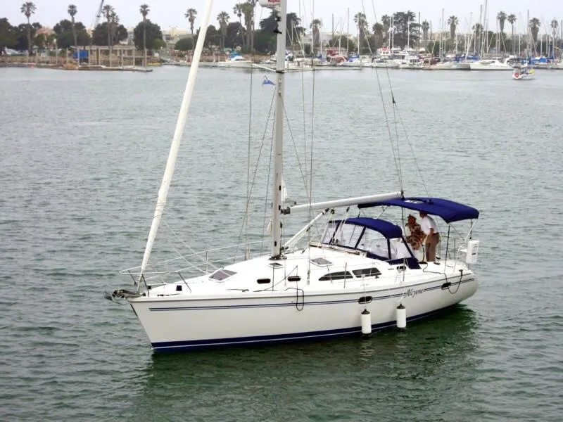 The Image of 2007 Catalina 350 sailboat on calm water with marina background. - 0