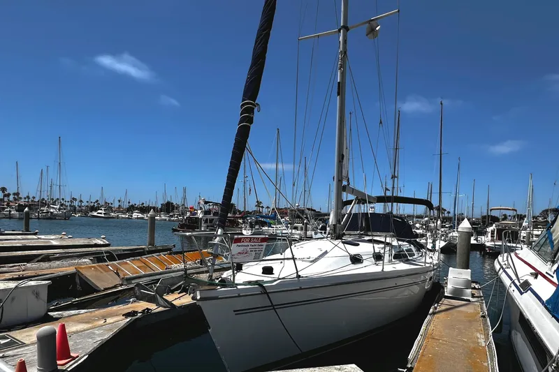 Slide: The Image of Catalina 350 sailboat from 2007 docked at marina, clear blue sky. - 11
