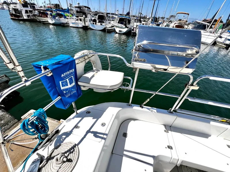 Slide: The Image of Catalina 350 sailboat deck with lifesaving equipment and marina view, 2007 model. - 22