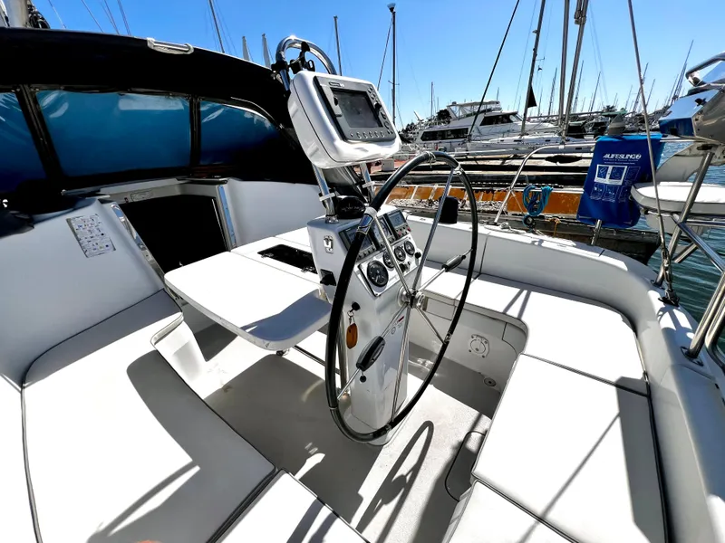Slide: The Image of Cockpit of 2007 Catalina 350 sailboat with steering wheel and navigation equipment. - 23