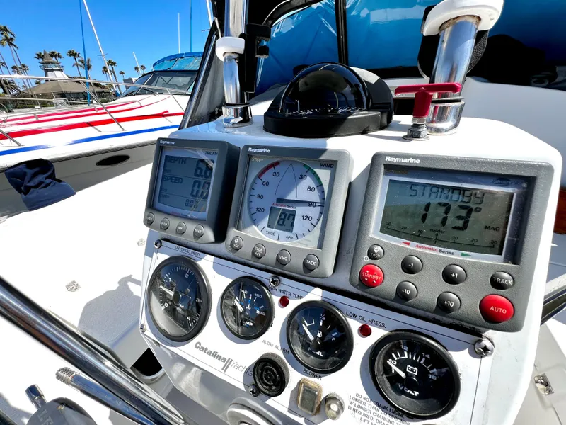 Slide: The Image of Control panel of a 2007 Catalina 350 sailboat with navigation instruments and gauges. - 27