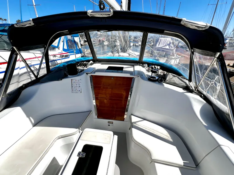 Slide: The Image of Cockpit of 2007 Catalina 350 sailboat with seating and wooden hatch. - 31