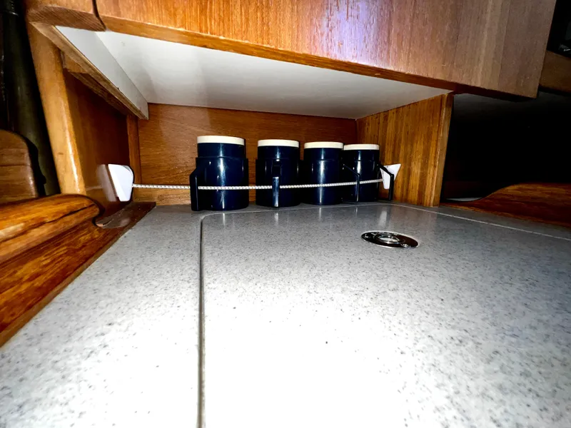 Slide: The Image of Wooden interior of a 2007 Catalina 350 yacht with spice jars on a countertop. - 36