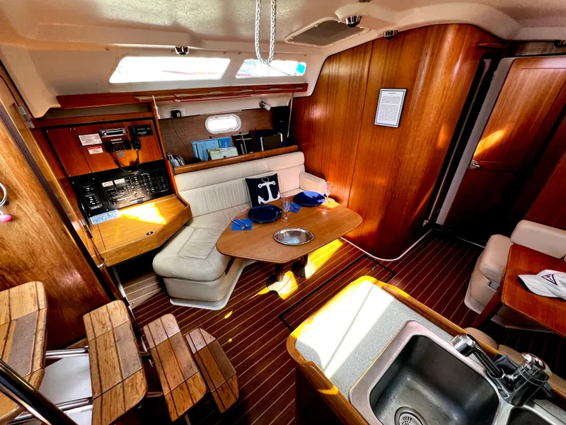 Slide: The Image of Interior of 2007 Catalina 350 yacht with wooden finish and cozy seating area. - 40