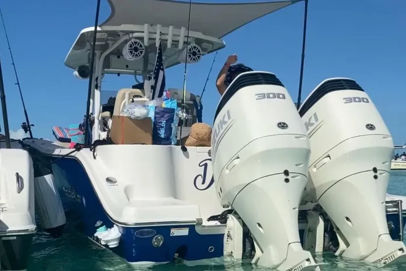 Slide: The Image of Control panel of a 2018 NauticStar 28 XS boat with engine switches and windlass controls. - 18