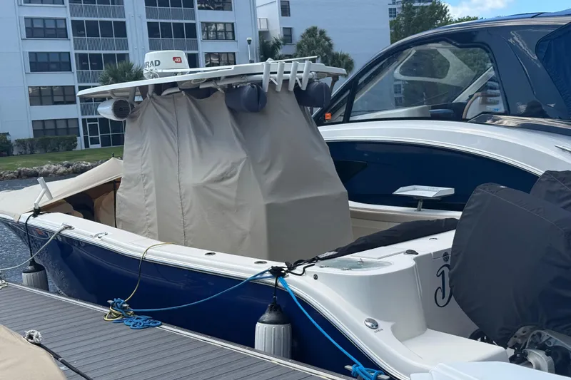 Slide: The Image of Control panel of a 2018 NauticStar 28 XS boat, featuring engine and windlass switches. - 19