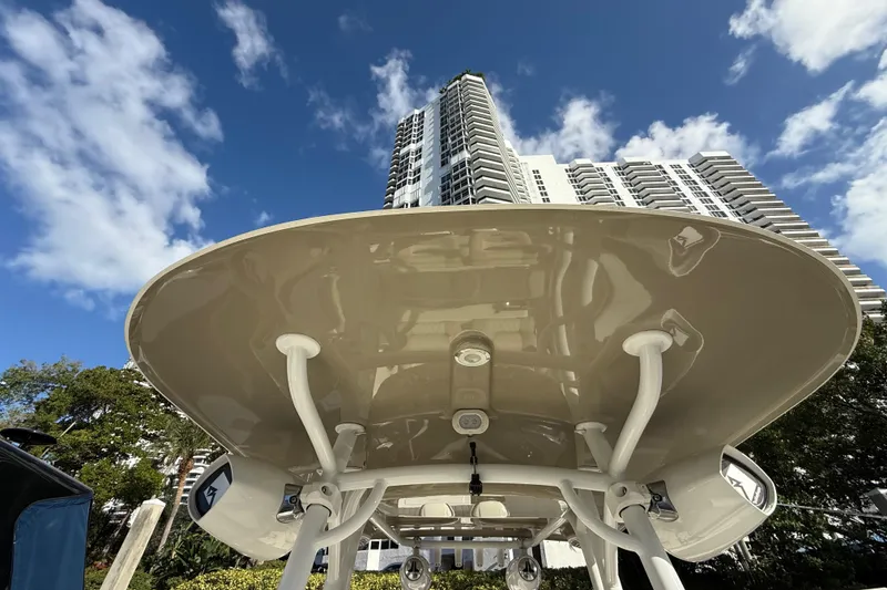 Slide: The Image of 2018 NauticStar 28 XS boat with city skyscraper backdrop under blue sky. - 40