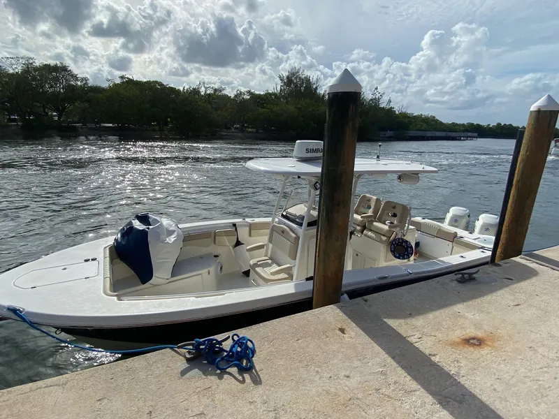 Slide: The Image of 2018 NauticStar 28 XS boat livewell with open lid and visible interior. - 7