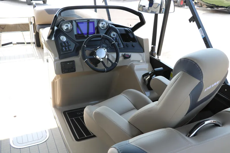 Slide: The Image of 2025 Sylvan L3 RLZ boat cockpit with modern steering and controls. - 19