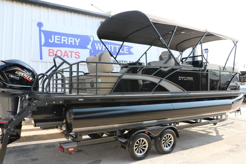 Slide: The Image of 2025 Sylvan L3 RLZ pontoon boat on trailer at dealership. - 2