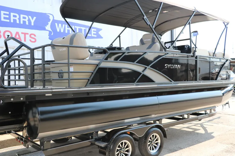 Slide: The Image of 2025 Sylvan L3 RLZ pontoon boat on trailer, featuring sleek black design and canopy. - 3